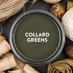 a jar with the word collard greens on it surrounded by wine corks and garlic