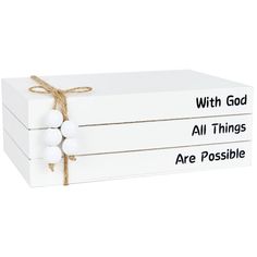 three white boxes tied with twine and saying, with god all things are possible