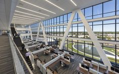 the interior of an office building with large windows