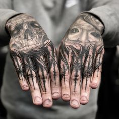 a man with his hands covered in black ink