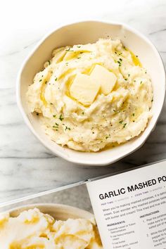 a bowl filled with mashed potatoes next to a book