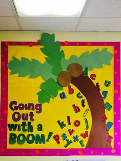 a bulletin board with the words going out with a boom in front of a tree