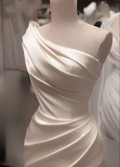 a white dress on display in a store