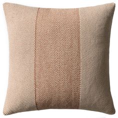 a brown and beige pillow on a white background