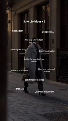 a man walking down the street in front of a building with words written on it