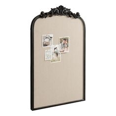 a black frame with pictures hanging on it