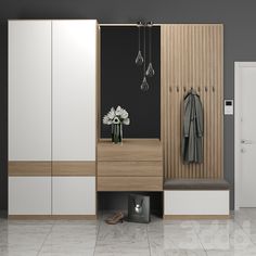 a white and brown closet with some flowers in the vase next to it on top of a tiled floor