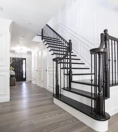 a black and white staircase in a house