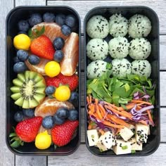 two trays filled with different types of food on top of a wooden table next to each other