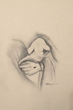 a pencil drawing of a person holding a baby in their arms and the child's head