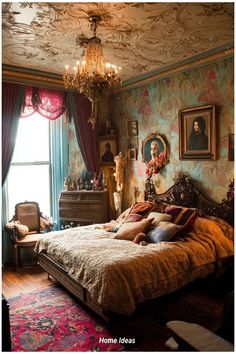 a bed sitting in a bedroom under a chandelier next to a large window