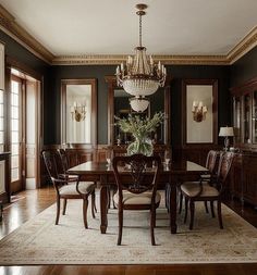 an elegant dining room with chandelier and chairs