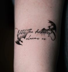 a woman's arm with a dragon tattoo on it that says, hit the happy living