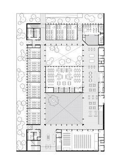 the floor plan for an office building with tables and chairs, in black and white