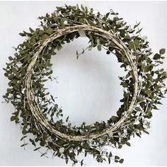 a wreath made out of branches and leaves