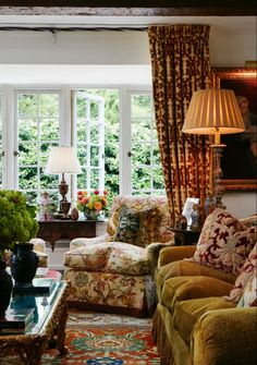 a living room filled with furniture and windows