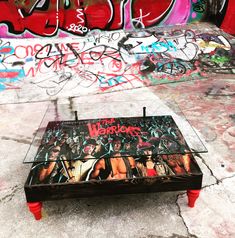 a coffee table that has some graffiti on it