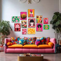 a living room filled with furniture and lots of pictures on the wall above it's colorful couch