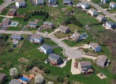 an aerial view of several houses and roads