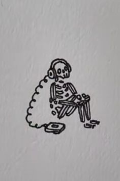 a drawing of a skeleton sitting on top of a table with headphones in his ears