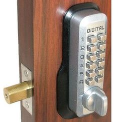 an electronic door lock on a wooden door