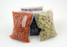 three bags filled with beans sitting next to each other