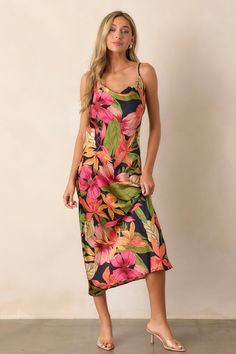 Get ready to make a statement with our Just A Moment Black Floral Midi Dress! This bold and playful dress features a stunning black floral pattern that will turn heads. Perfect for any occasion, this midi dress will have you feeling confident and stylish. This dress features a cowl neck, adjustable straps and silky fabric. 100% Polyester Unlined Hand Wash Cold Designed in USA Manufactured in China Model is 5'8" wearing a size Small Red Silk Midi Dress With Floral Print, Vibrant Floral Print Midi Dress, Vibrant Red Floral Print Dress, Red Floral Print Knee-length Midi Dress, Multicolor Abstract Print Knee-length Midi Dress, Going Out Looks, Preppy Girls, Rush Dresses, Women's Shapewear