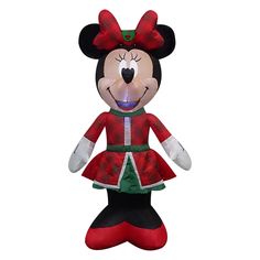 a mickey mouse stuffed animal wearing a red and green dress with lights in it's mouth