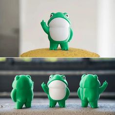 three green and white frog figurines sitting on top of a cake, one with its mouth open