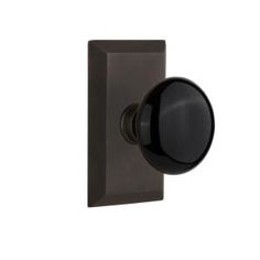 an image of a door knob on the side of a house or office building in dark brown