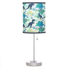 a lamp that has dinosaurs on it