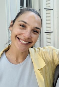 a man and woman smiling at the camera