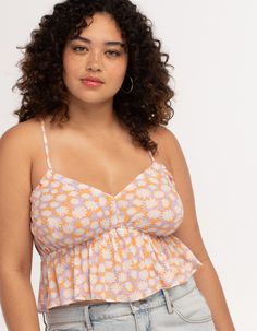 Rsq Daisy X-Back Babydoll Top. All Over Print. Adjustable X Back Ties. Ruffle Hem. Elastic Waist. 100% Rayon. Hand Wash. Imported. Model Is Wearing A Size Small. Model Measurements:height: 5'8" Bust: 30"waist: 23"hips: 35" Model Is Wearing A Size Xl. Model Measurements:height: 5'8" Bust: 42"waist: 32"hips: 44" Playful Sleeveless Floral Print Top, Playful Floral Print Sleeveless Top, Cute Floral Print Camisole Top, Playful Orange Beach Top, Cute Cami Beach Tops, Cute Cami Tops For Beach, Cute Floral Print Cami Top, Cute Orange Beach Tops, Wwe T Shirts