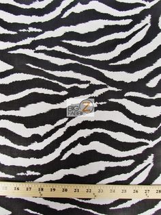 a zebra print fabric with a ruler in front of it