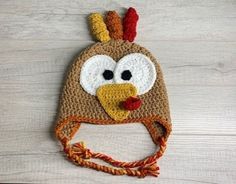 a crocheted hat with a turkey face on it