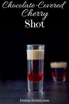 chocolate - covered cherry shot in a tall glass on a black table with the title above it