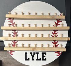 a wooden sign with baseball bats on it