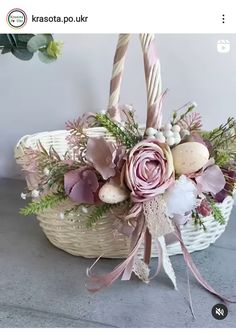 a basket filled with flowers on top of a table