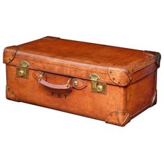 an old brown suitcase with brass handles on a white background for use in advertising purposes