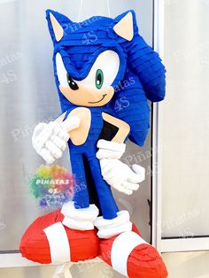 sonic the hedgehog balloon hanging in front of a window