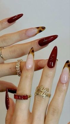 many different types of nails are arranged in the shape of hands with rings on them