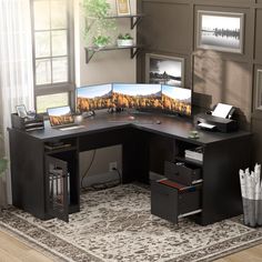 a computer desk with two monitors on it