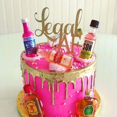 a birthday cake decorated with liquor and condiments