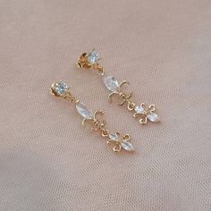 **All orders come with tracked shipping** PLUS **Free shipping on orders over $35 USD for US customers** High quality champagne gold plated Gatsby style earrings with clear cubic zirconia stones.  There are 2 jewelry box options: Box A: regular jewelry cardboard box with a textured diamond pattern on the outside (comes in white, black or red) Box B: Velvet earring and necklace box (comes in green, red and grey) as shown in the pictures You can also add a mini gift bag as show in the pics: comes Vintage Chandelier Dangle Earrings For Anniversary, Delicate Gold Crystal Earrings For Party, Delicate Gold Chandelier Earrings For Party, Delicate Gold Chandelier Earrings For Formal Occasions, Gold Delicate Crystal Earrings For Party, Delicate Chandelier Earrings For Formal Occasions, Delicate Chandelier Earrings For Formal Events, Victorian Chandelier Dangle Earrings For Party, Vintage Bridal Earrings With Elegant Design