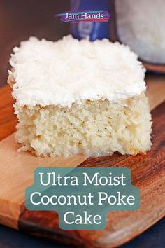 a close up of a piece of cake on a cutting board with the words ultra moist coconut poke cake