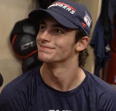 a man wearing a hat in a locker room