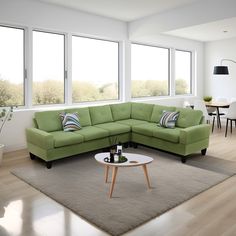 a living room with a sectional couch and coffee table in front of two large windows