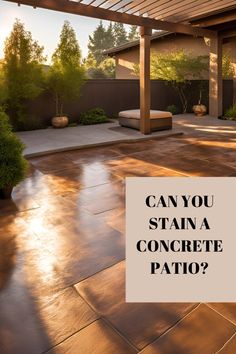 a patio with the words can you stain a concrete patio?