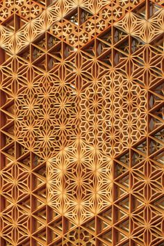 an intricate wooden structure with geometric designs on it