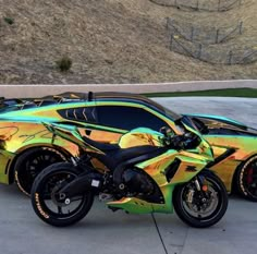 a colorful motorcycle parked in front of a car